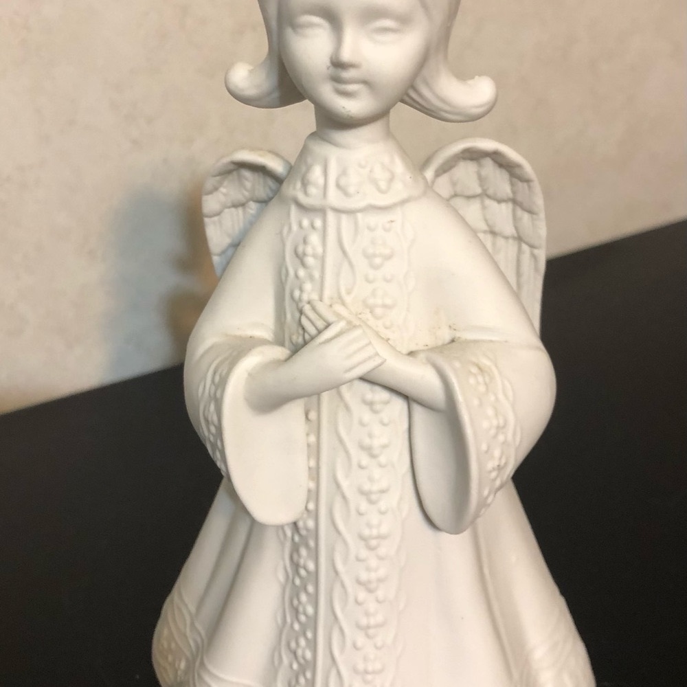 Musical Angel Turns On Base White Color